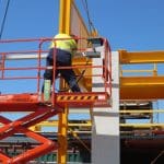 Operate Elevating Work Platform (RIIHAN301E) — worker on a scissor lift performing tasks at height.
