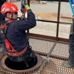 RIIWHS202E Enter and Work in Confined Spaces training showing a worker approaching a confined space with safety gear.