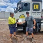 TLIC4006 Drive Multi‑Combination Vehicle training — multi‑combination truck with multiple trailers on the road.