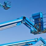 Blue articulated boom lifts (elevating work platforms) used for high-risk work at heights in TLILIC0005 training.